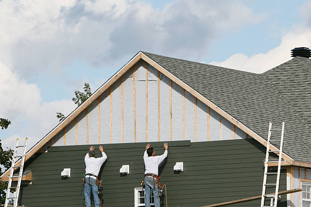 Professional Siding Replacement technician working in Roslyn Heights, NY